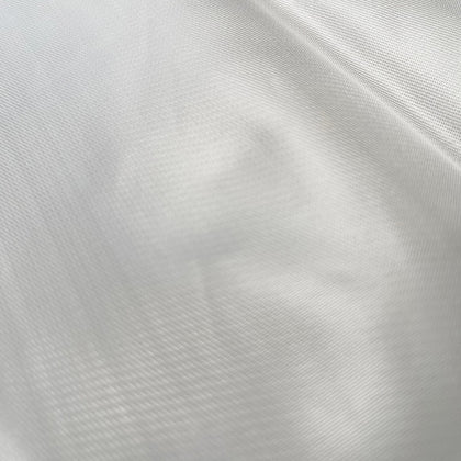 Close-up of a white, solid-patterned mash filter cloth.